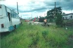 The rescue team reloading cement bags from derailed cars into new cars